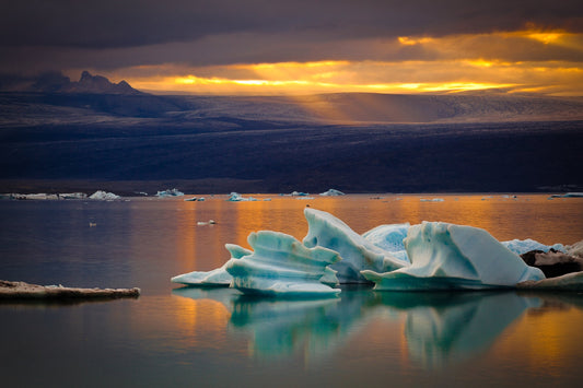 Turquoise icebergs under golden evening light at Jökulsárlón Glacier Lagoon, Iceland — fine art photography print by Martin Sojka